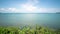 White Clouds move in the Clear blue Sky over sea near Phuket City. Motion Time lapse White clouds swim and change shape.Puffy fluf