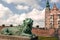 White clouds over lion bronze sculpture guard at the entrance of Rosenborg Castle, 17th century. Copenhagen, Denmark