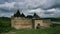 White clouds passing by over an old castle in Khotin, Ukraine