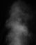 White clouds of smoke vapor isolated on a black background. The magic effect can be used when changing transparency