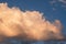 White clouds in summer blue sky at golden hour