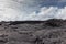 White cloudscape over field of 2018 Kilauea volcano lava, Leilani Estate, Hawaii, USA