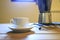 White Cofee cup in a wooden table