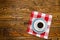 White Coffee cup top view on old wooden table. Aromatic coffee drink in white cup on brown wooden table