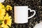 White coffee mug blank mockup and sunflowers on plush leopard animal blanket, flatlay, copyspace