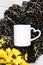 White coffee mug blank mockup and sunflowers on plush leopard animal blanket, vertical flatlay, copyspace