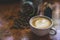 White coffee mug. Coffee is a latte. table on the wooden table in vintage style, taken from the top view, see the froth of milk