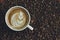 White coffee mug. Coffee is a latte. table on the wooden table in vintage style, taken from the top view, see the froth of milk