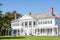 White Colonial with Green Shutters