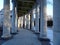 White colonnade in the cold winter snowy forest