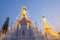 A white color of pagoda decorated by lighting at night time