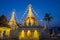 A white color of pagoda decorated by lighting at night time