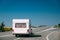 White Colour Motorhome Car Goes On Motorway Road