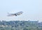 White commercial airplane flying take off from runway at Samui Airport, Samui island, Surat Thani, Thailand