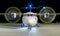 White commercial plane with engines running and propeller blur on a night with the moon on background