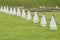 white concrete pillars with black chain. Fencing of the protected object in the Park