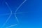 White contrail line on the blue sky