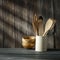 White cook hat with kitchen tools on wooden background