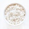 White cooked rice in a white bowl over white background close u