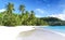 White coral beach sand and azure indian ocean.