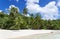 White coral beach sand and azure indian ocean.