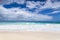 White coral beach sand and azure indian ocean.