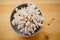 White coral in cup on wooden background. rare mineral from bottom of the sea