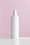 White cosmetic shampoo dispenser bottle mockup with pink background