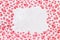 White cotton fabric in red floral patterns. Bright colored background with rectangular copy space in the middle