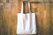 White cotton linen shopping bag tote on old wood nature background save world save earth go green concept living life idea