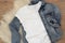 White cotton T-shirt and denim jacket mockup. Woman shirt mock ups. Blank clothes template mock up. Flat lay styled stock photo