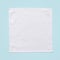 White cotton towel mock up template square size fabric wiper isolated on blue background with clipping path, flat lay top view