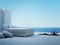 White couch standing on a patio with seascape view
