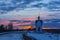 White country orthodox chapel and glimpses of a beautiful winter sunset