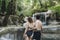White couple enjoying the waterfall