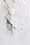 White cracked plastering wall background or texture