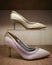 White and cream stilettos on wooden display