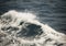 White crest of a sea wave. Selective focus. Shallow depth of fie