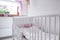 White crib in nursery room