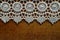 White crochet lace edge wooden table
