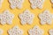 White crocheted stars pattern on a yellow background