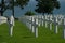 White crosses at the Normandy American Cemetery and Memorial, Colleville-sur-Mer, Normandy, France with the sea in the background