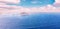 White cruise liner floats across blue sea into sunset. Concept travel. Aerial view