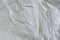 White crumpled paper blank background surface. Pastels book cover paint top view; Gray grunge surface empty parchment sheet. Art