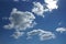 white Cumulus clouds on a blue sky background