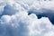 White cumulus clouds on blue sky background close up, overcast skies backdrop, fluffy cloud texture, beautiful sunny cloudscape