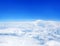 White cumulus clouds clear blue sky background, aerial cloudscape panoramic above view, high azure skies panorama, fluffy cloud