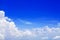 White cumulus clouds clear blue sky background, beautiful aerial cloudscape view from above, azure skies backdrop, fluffy cloud