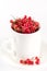 White Cup with Beautiful Tasty Ripe Red Currant Berry White Background Vertical Harvest