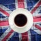 White cup of black coffee and British flag, Union Jack